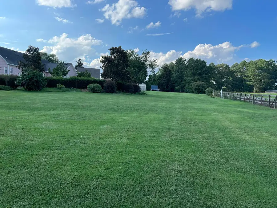Freshly installed sod lawn in front of a two-story home